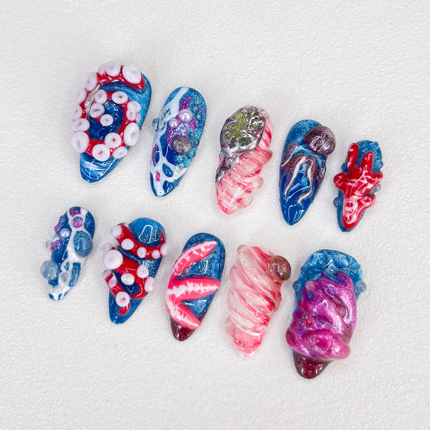 Underwater Whimsy press-on nails with vibrant ocean elements and whimsical designs, capturing the spirit of the sea.