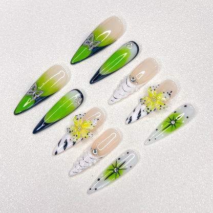 Neon Bloom press-on nails with neon green ombre, butterflies, and florals for a strikingly vibrant nature-inspired style.