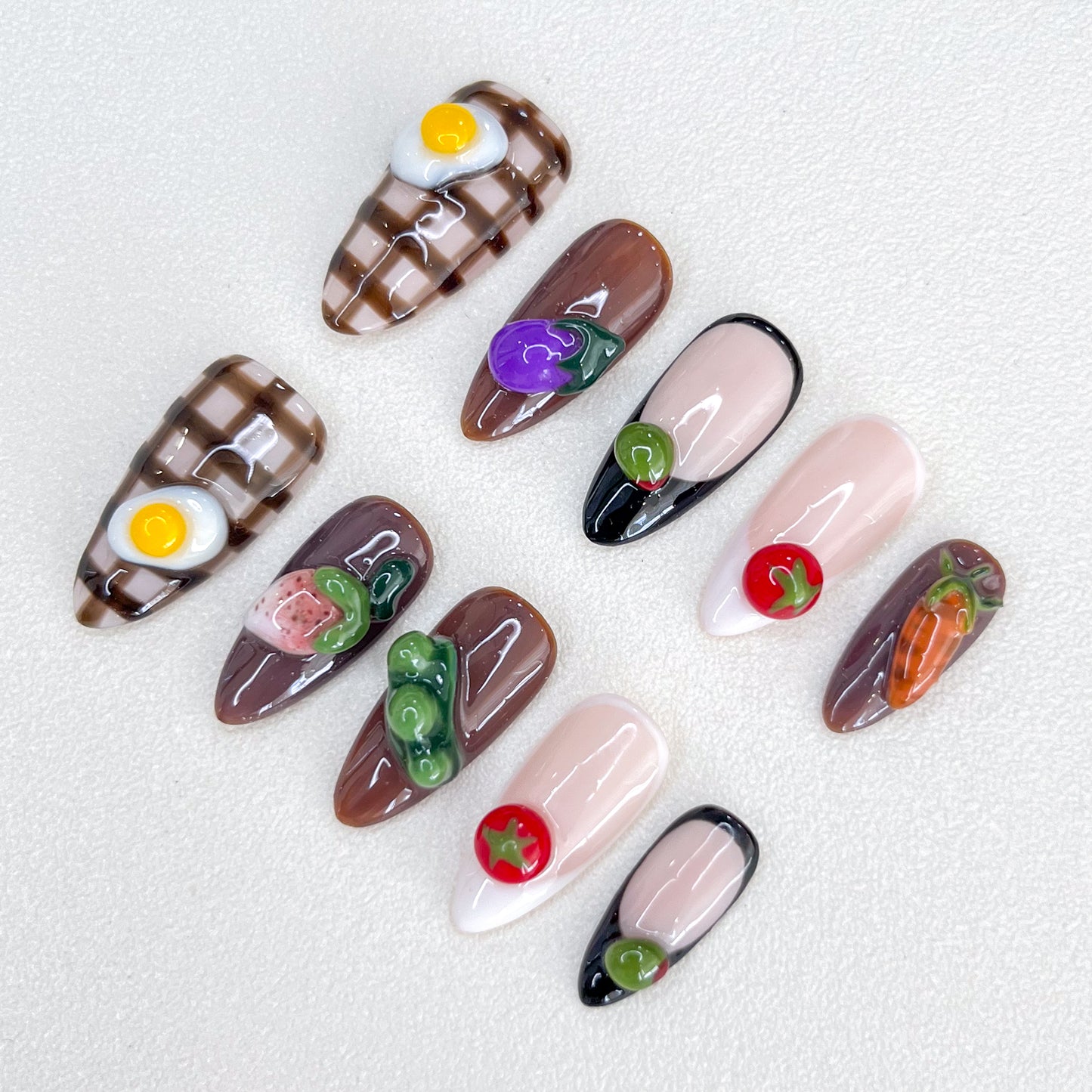 Farm Fresh press-on nails with 3D vegetable designs, including carrots, eggplants, and tomatoes, for a fun and quirky nail art style.