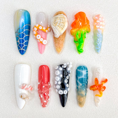 Underwater Fantasy press-on nails with coral, shells, and aquatic details in bold, colorful tones, perfect for ocean lovers.