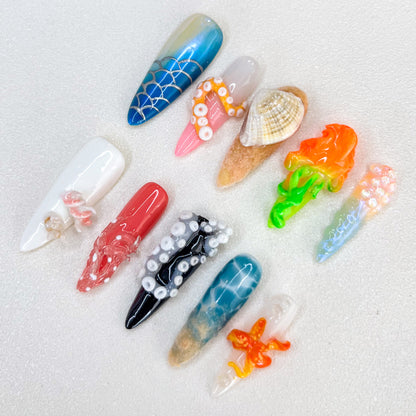 Underwater Fantasy press-on nails with coral, shells, and aquatic details in bold, colorful tones, perfect for ocean lovers.