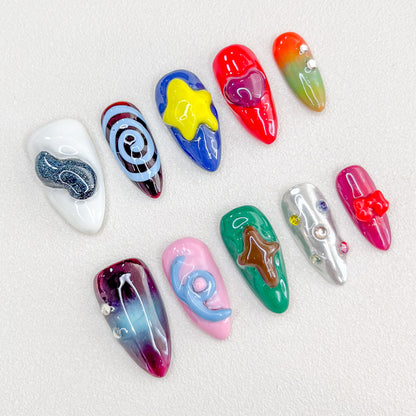 Cosmic Delight press-on nails with bold planetary and star designs in vivid colors, perfect for a unique, galactic look.