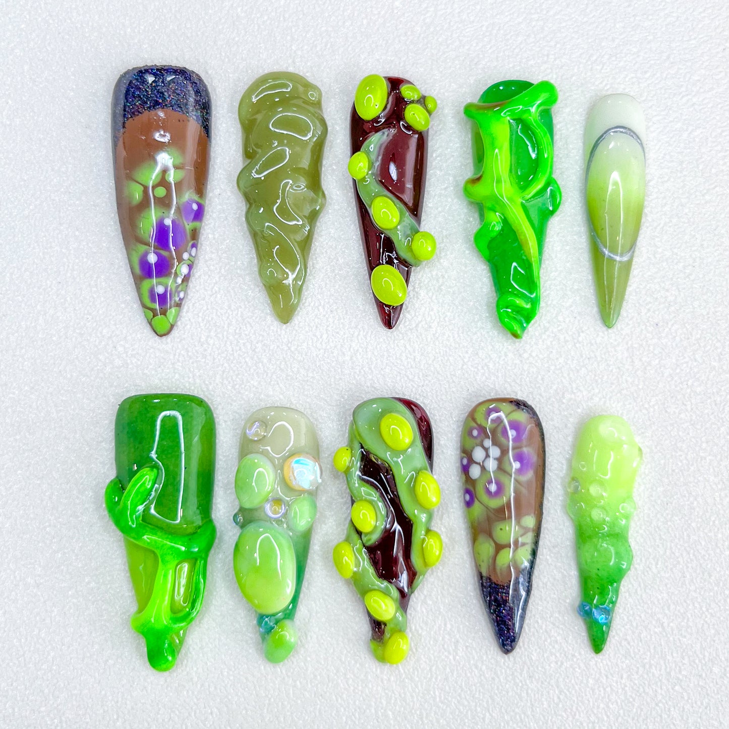 Enchanted Vine press-on nails with vine patterns and textured green accents, perfect for a forest-inspired aesthetic.