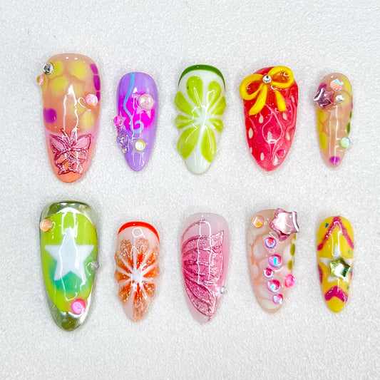 Tropical Bloom press-on nails with floral designs and tropical patterns, perfect for adding a touch of paradise.