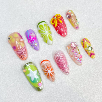 Tropical Bloom press-on nails with floral designs and tropical patterns, perfect for adding a touch of paradise.