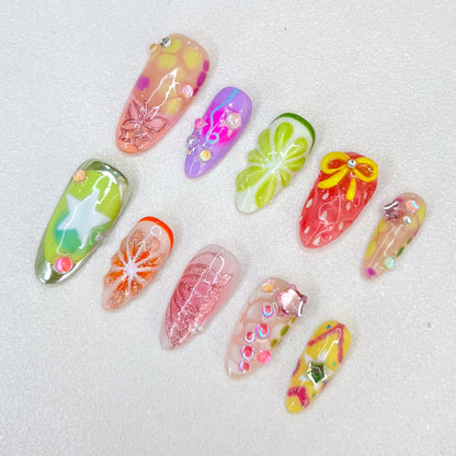 Tropical Bloom press-on nails with floral designs and tropical patterns, perfect for adding a touch of paradise.