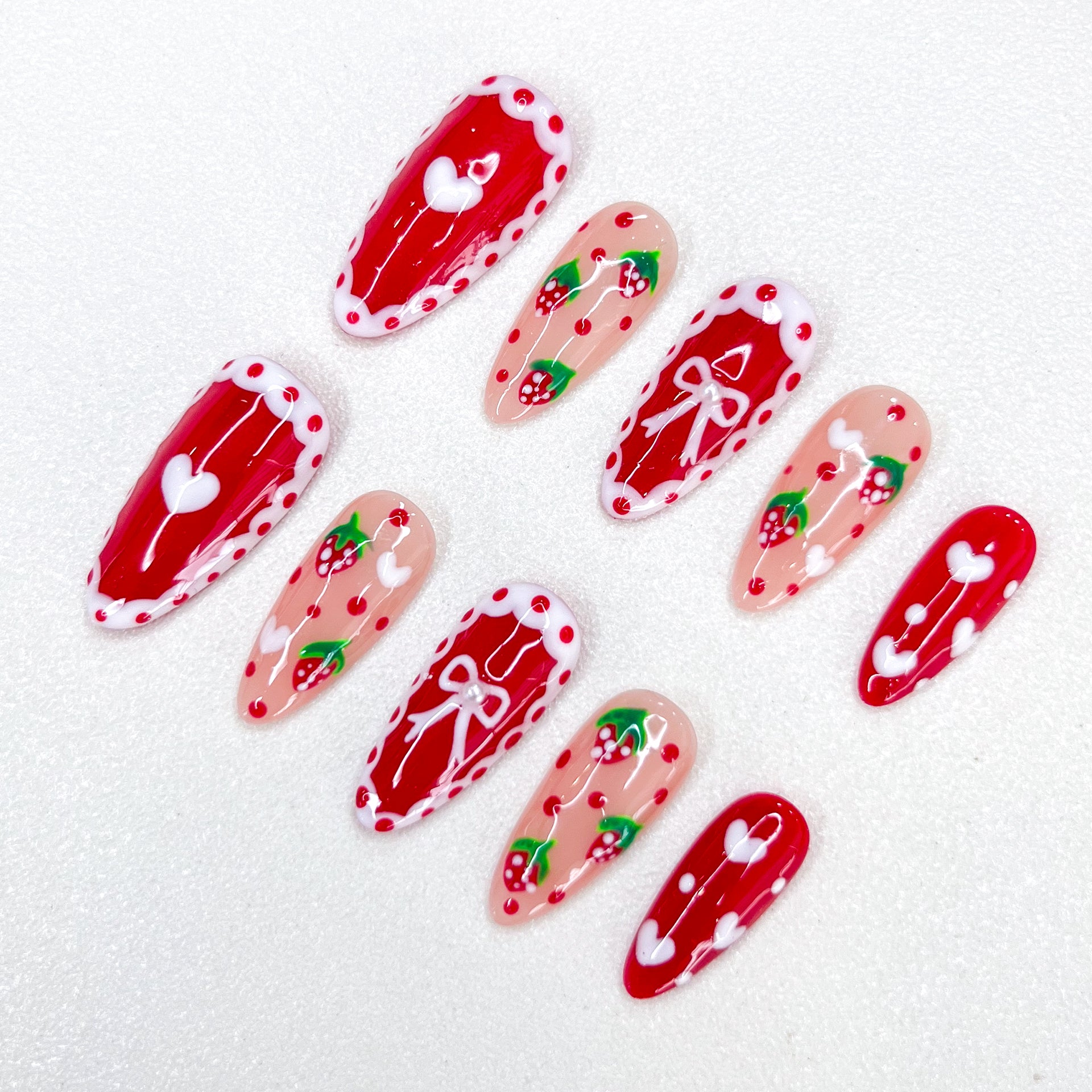 Berry Delight press-on nails with strawberry and lace designs, adding a touch of sweetness to your look.