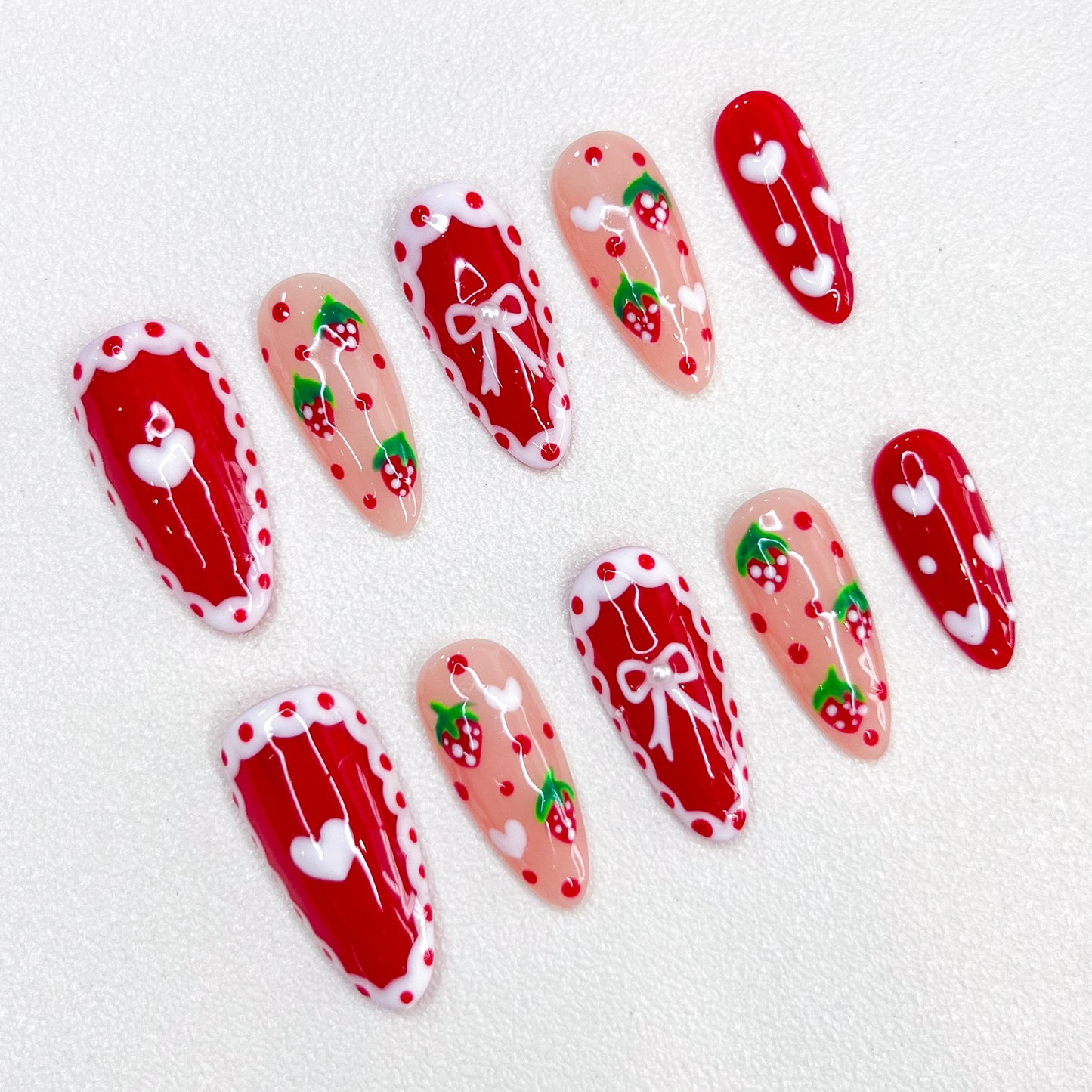 Berry Delight press-on nails with strawberry and lace designs, adding a touch of sweetness to your look.