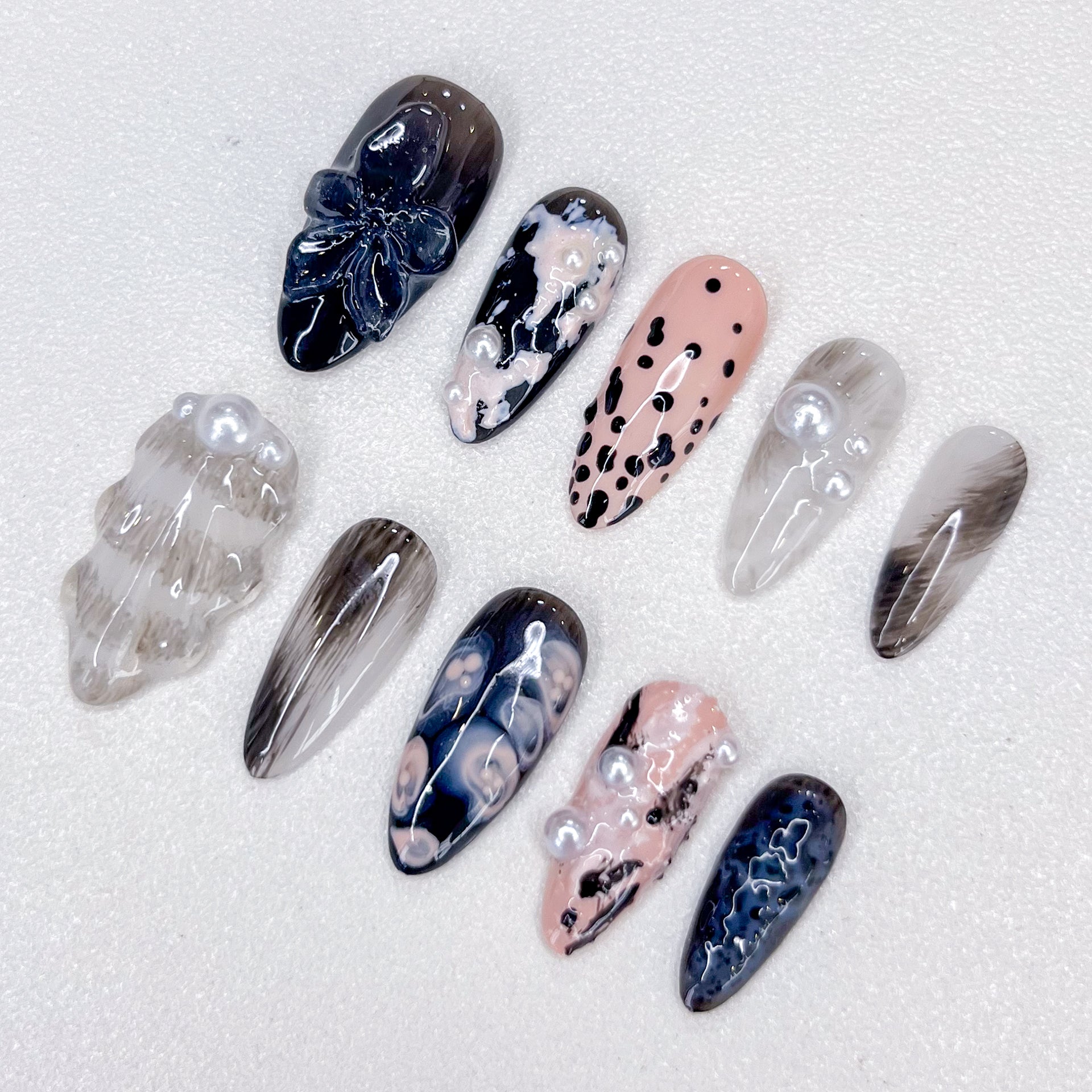 Midnight Pearl press-on nails with elegant black and pearl accents, perfect for a chic and refined look.