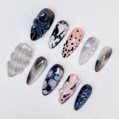 Midnight Pearl press-on nails with elegant black and pearl accents, perfect for a chic and refined look.