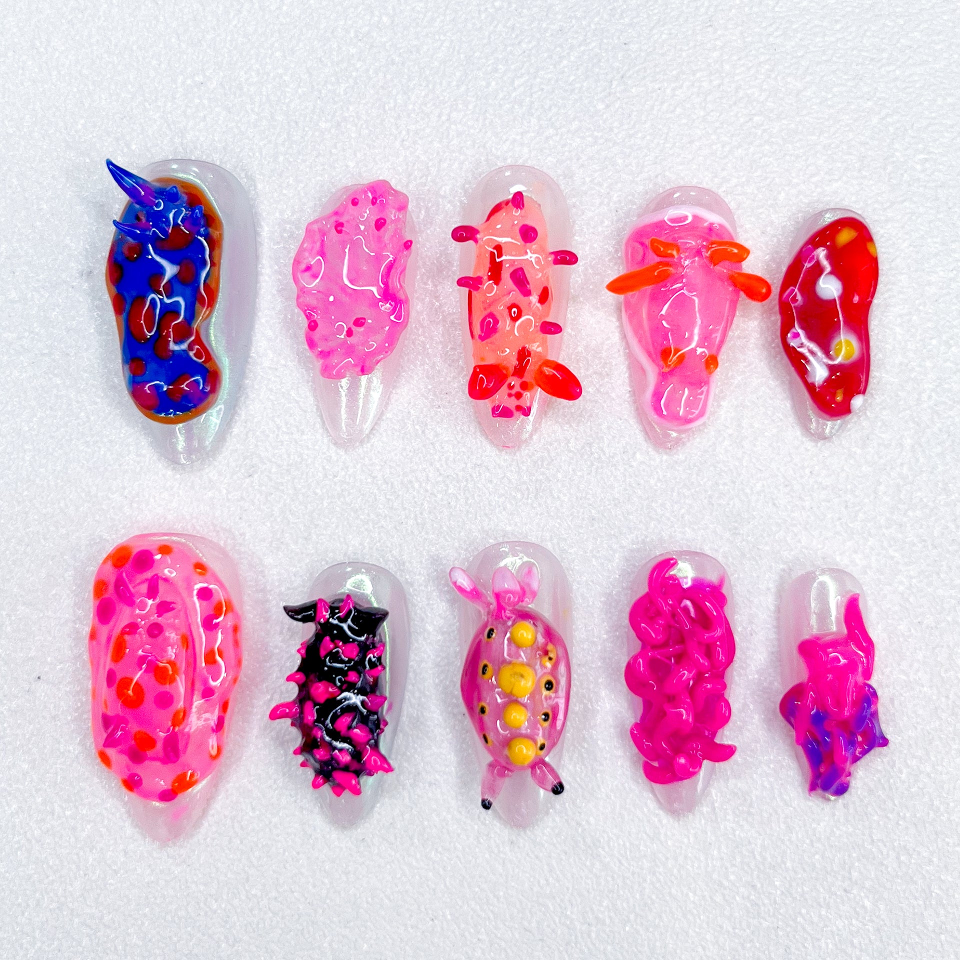 Coral Critters press-on nails with marine creature designs, bringing a splash of ocean-inspired fun to your nails.