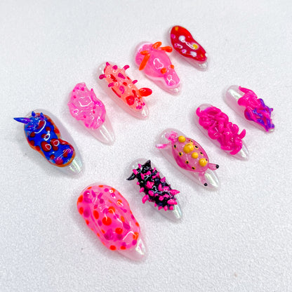 Coral Critters press-on nails with marine creature designs, bringing a splash of ocean-inspired fun to your nails.