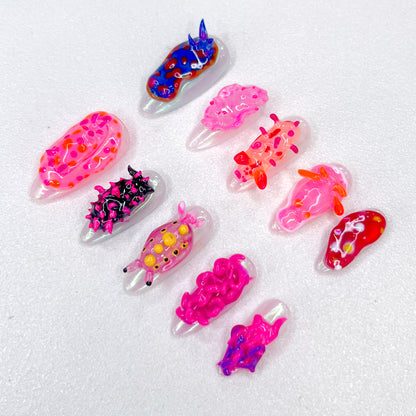 Coral Critters press-on nails with marine creature designs, bringing a splash of ocean-inspired fun to your nails.