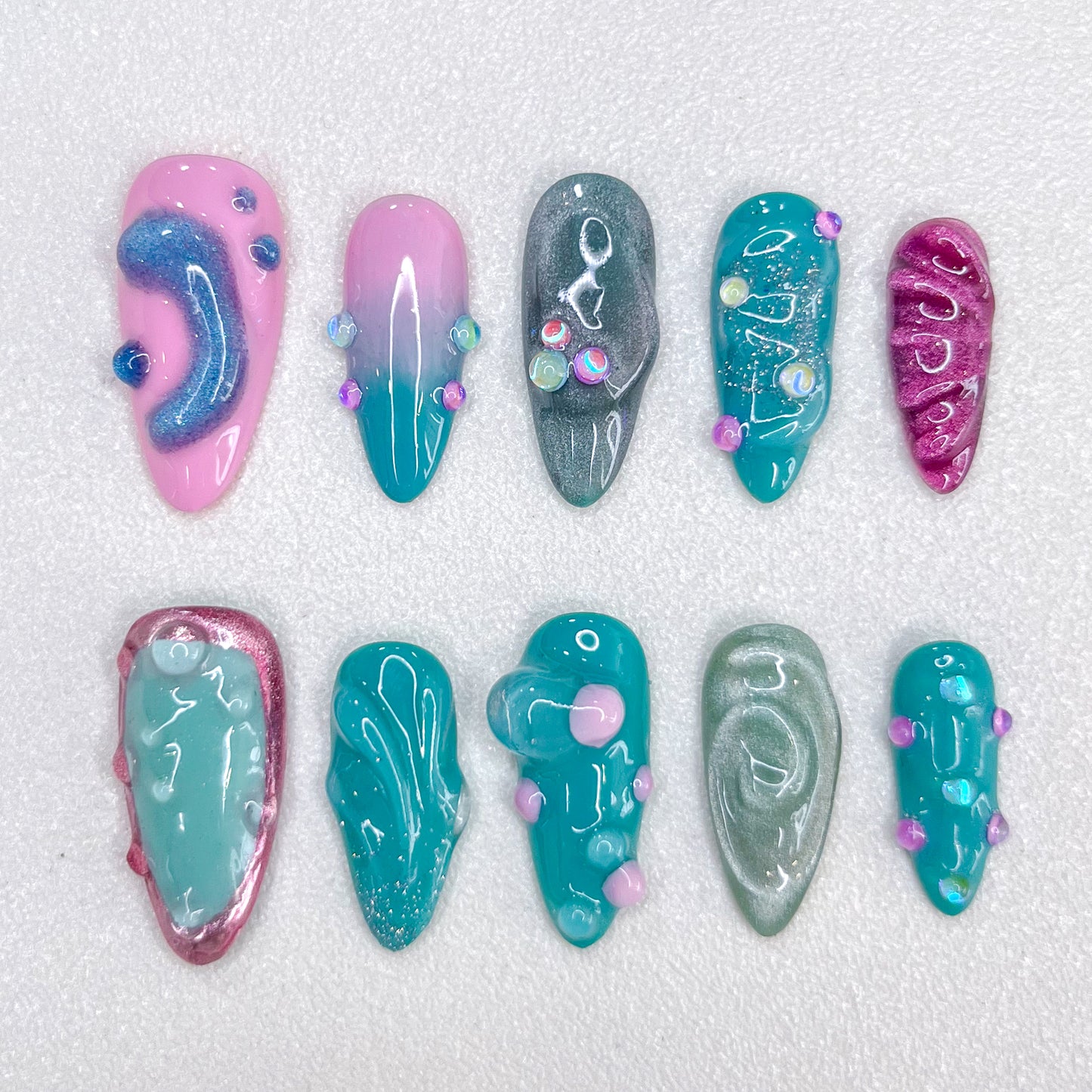 Pastel Lagoon press-on nails with pastel shades and 3D accents for a dreamy aesthetic.