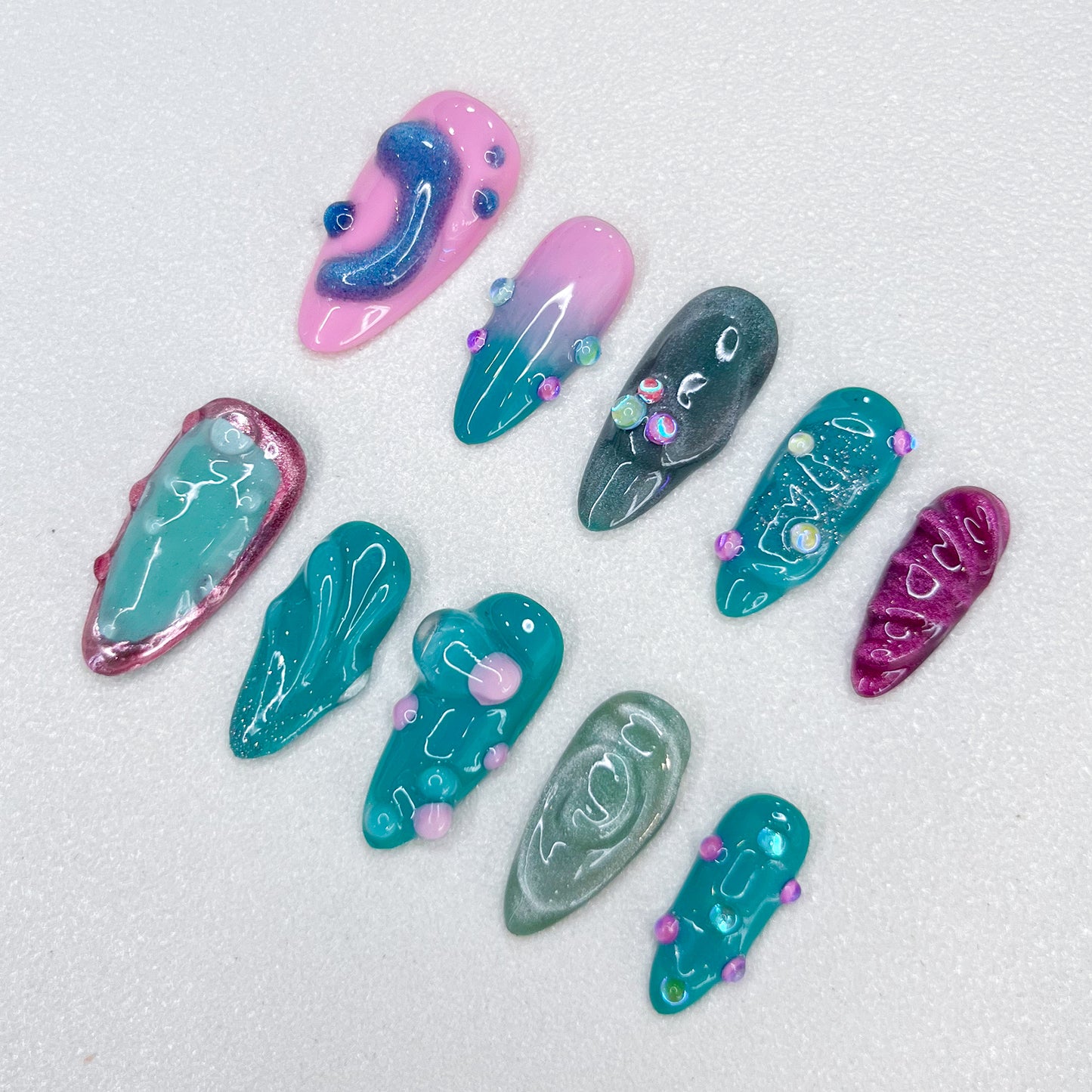 Pastel Lagoon press-on nails with pastel shades and 3D accents for a dreamy aesthetic.