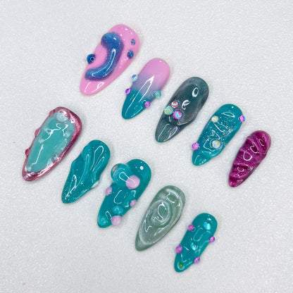 Pastel Lagoon press-on nails with pastel shades and 3D accents for a dreamy aesthetic.