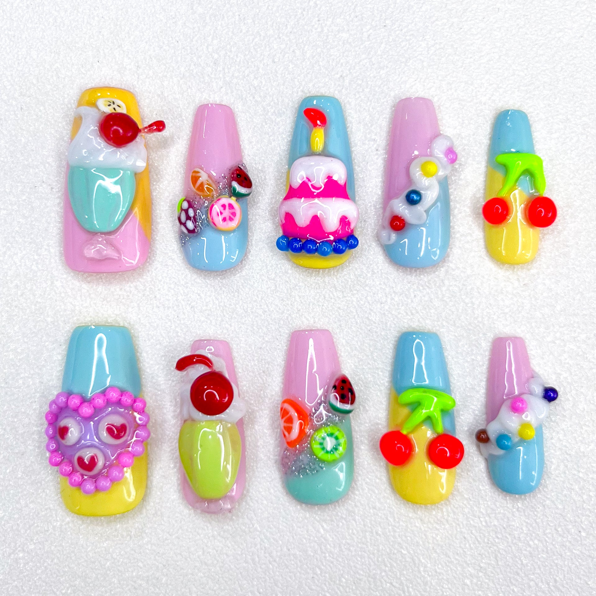 Sweet Confections press-on nails with dessert-inspired designs, perfect for a colorful and creative style.