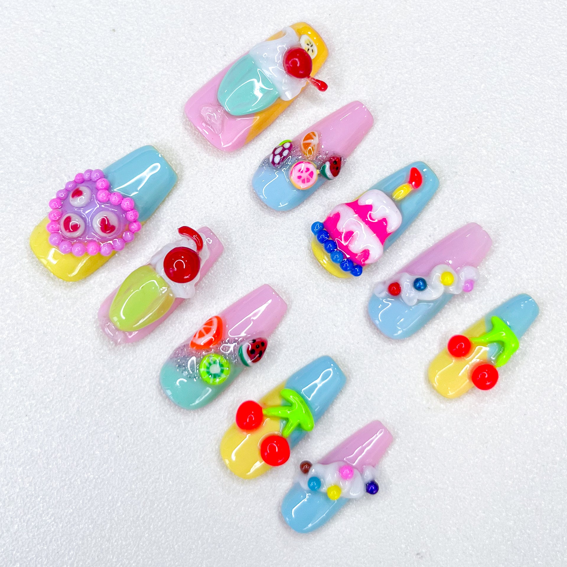 Sweet Confections press-on nails with dessert-inspired designs, perfect for a colorful and creative style.