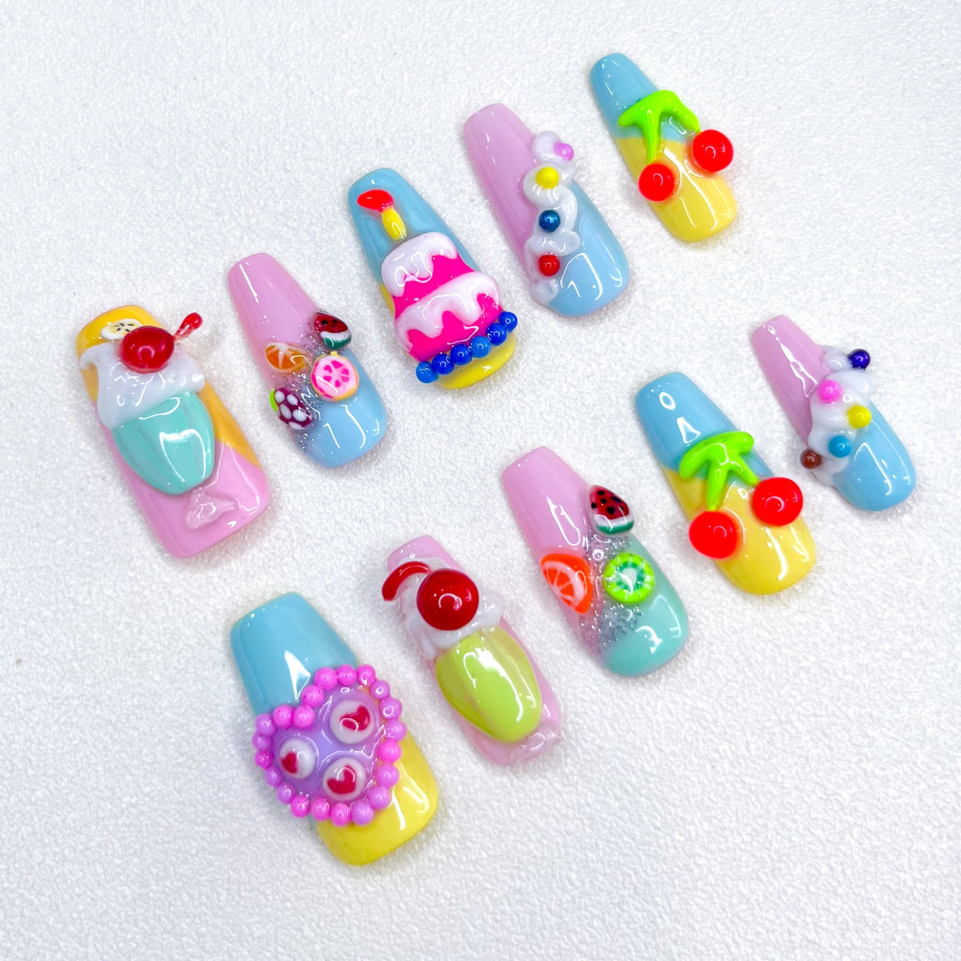 Sweet Confections press-on nails with dessert-inspired designs, perfect for a colorful and creative style.