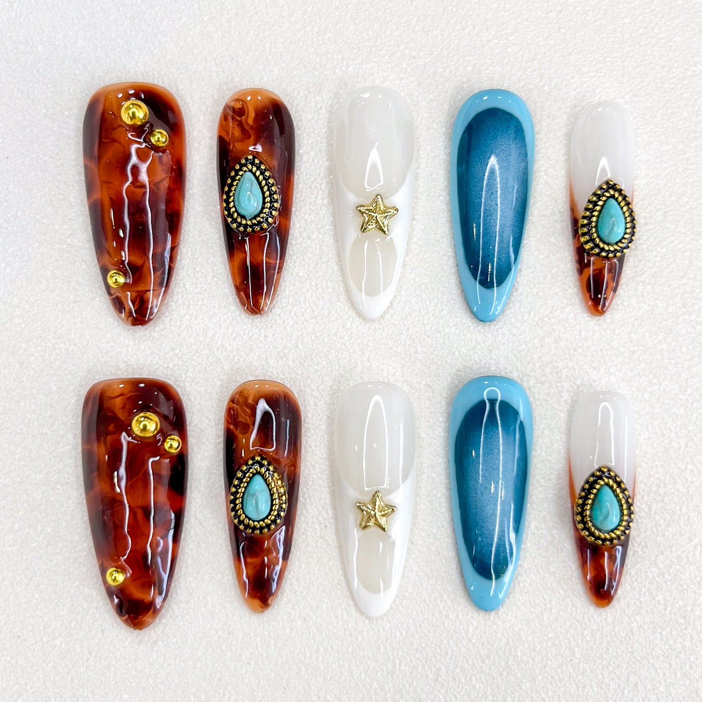 Desert Star press-on nails with tortoiseshell patterns and turquoise details, perfect for a desert-inspired, bohemian chic vibe.