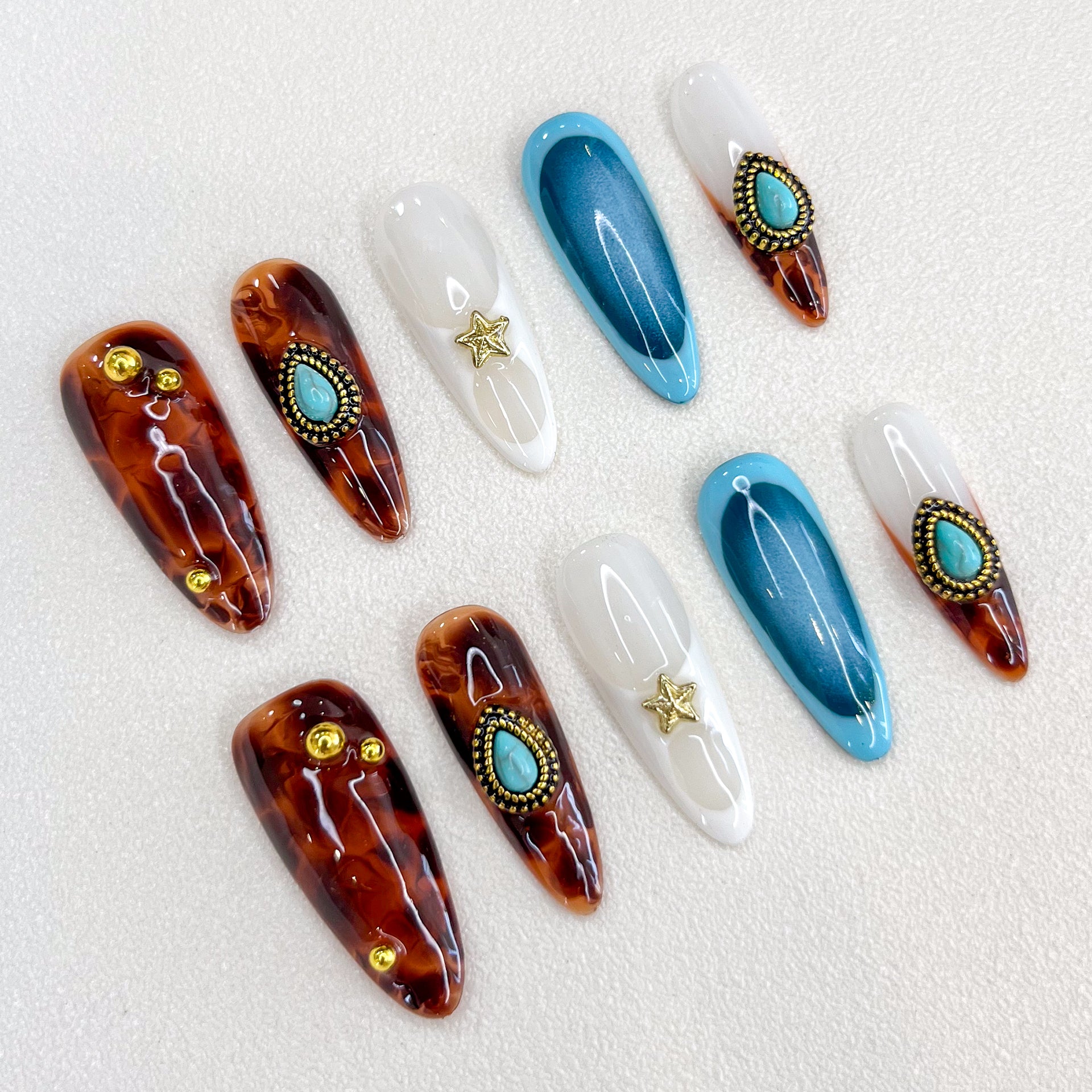 Desert Star press-on nails with tortoiseshell patterns and turquoise details, perfect for a desert-inspired, bohemian chic vibe.