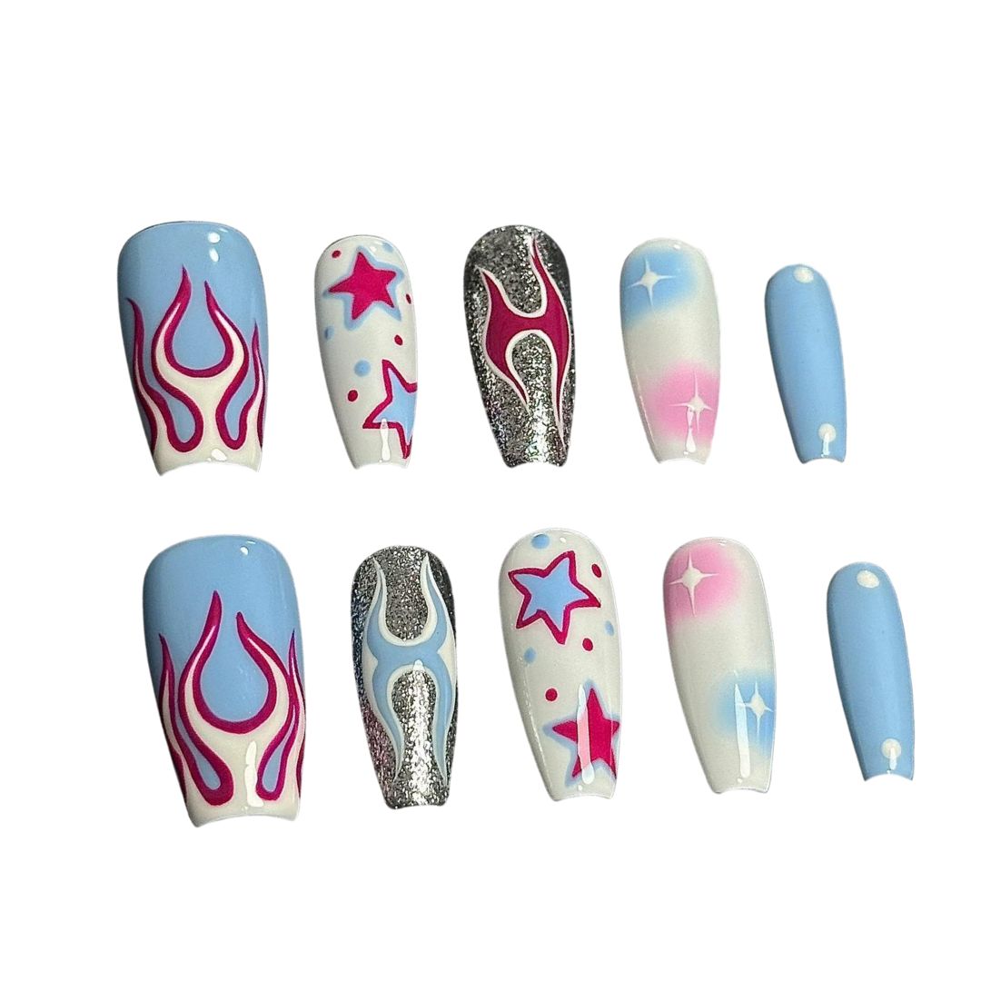 A press-on nail set featuring pink flames, starry designs, and pastel gradients with shimmering silver accents, creating a vibrant and edgy cosmic aesthetic.