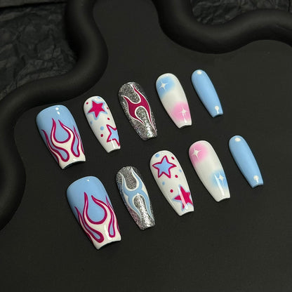 A press-on nail set featuring pink flames, starry designs, and pastel gradients with shimmering silver accents, creating a vibrant and edgy cosmic aesthetic.