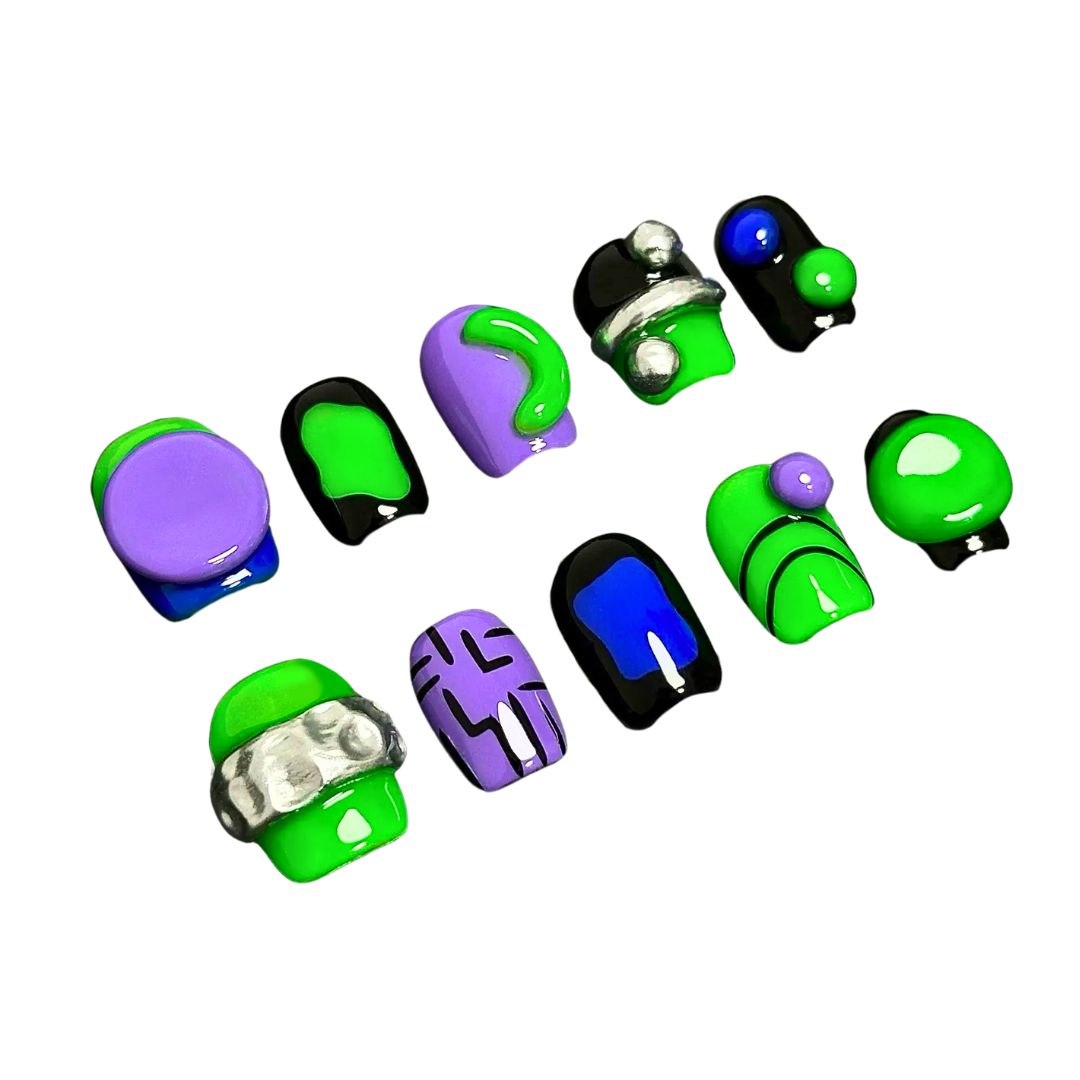 A press-on nail set featuring vibrant green and purple designs with black accents, metallic silver details, and 3D elements, creating a futuristic and modern aesthetic.