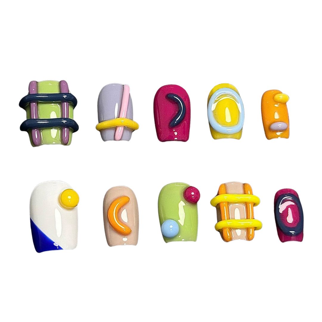 A press-on nail set featuring vibrant colors, raised 3D elements, and geometric patterns, creating a playful and modern artistic aesthetic.