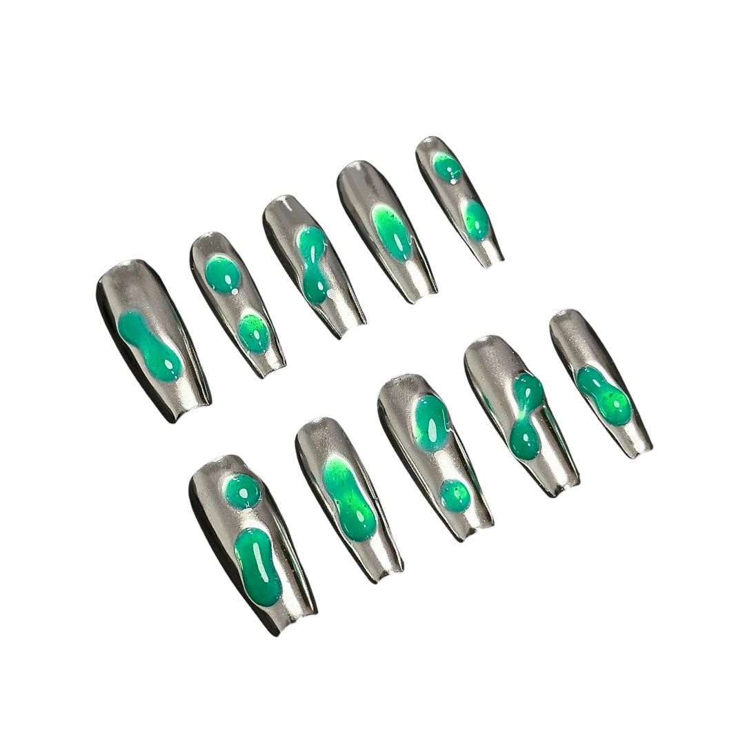 A set of metallic silver press-on nails with hand-painted green liquid-like patterns, showcasing a futuristic, high-tech nail design perfect for bold, statement-making looks.