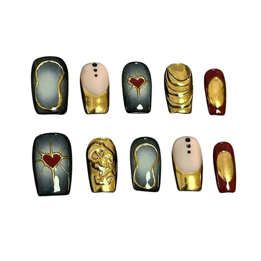 A set of luxurious press-on nails featuring gold accents, red heart motifs, and vintage-inspired designs, combining black, gold, and red hues for an elegant and regal look.