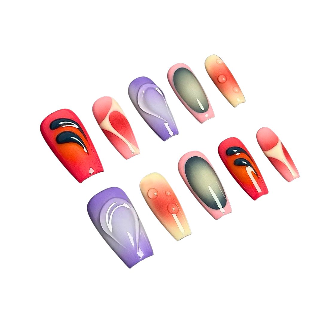 A press-on nail set featuring pink, purple, and red gradients with abstract glossy patterns and 3D droplet effects, creating a bold and artistic aesthetic.