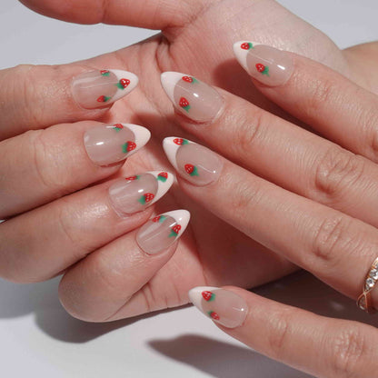 Pale pink nails adorned with hand-painted red strawberries and green leaves. This design captures the essence of a summer garden, blending fun and sophistication effortlessly.