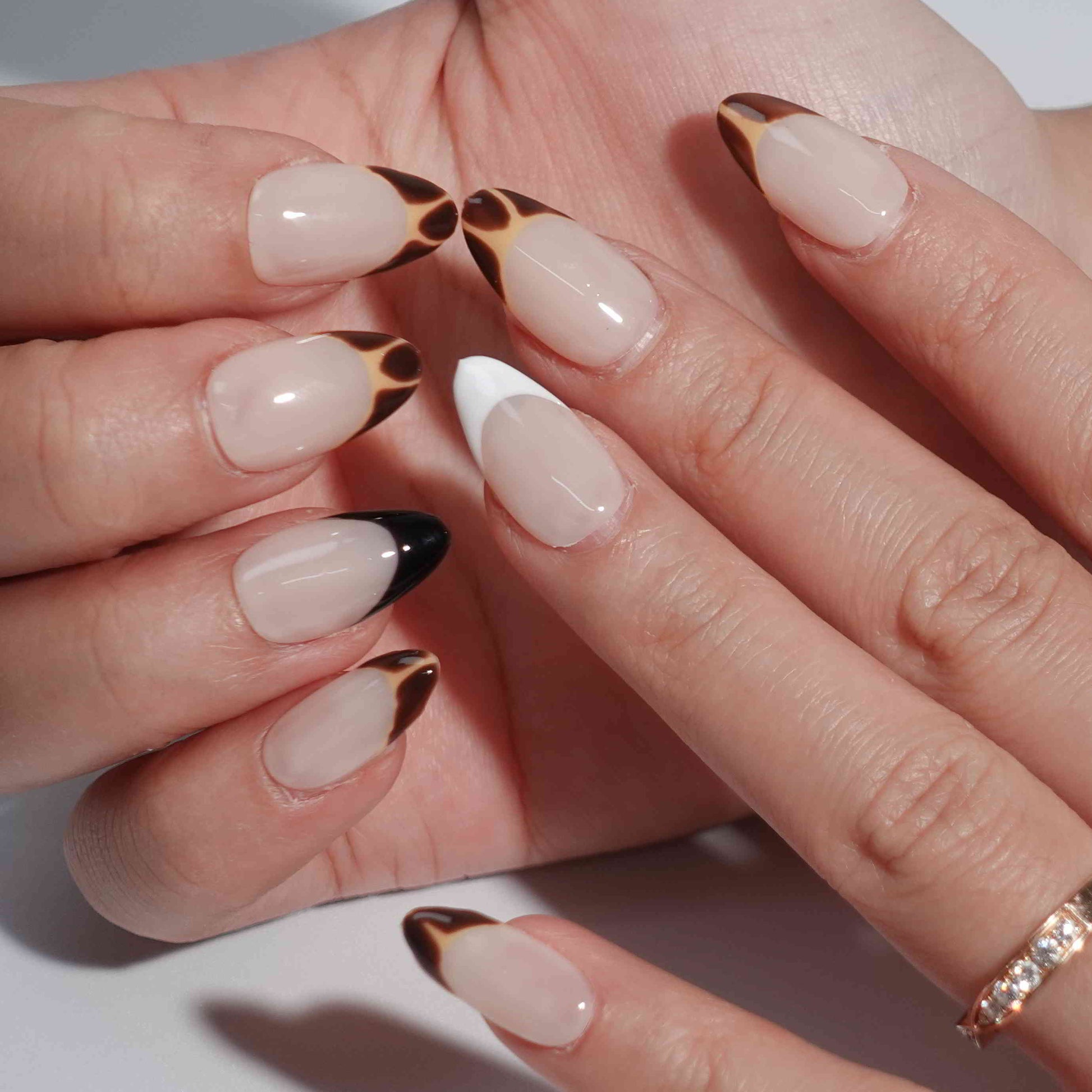 Coffee Blend nail set highlights a gradient of coffee-inspired hues transitioning from deep brown to creamy white, creating a cozy and stylish appearance.