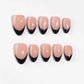A bold nail design named "Eclipse Noir," combining nude nails with sleek black French tips. This set evokes the mystique and contrast of a lunar eclipse, offering a contemporary take on timeless elegance for evenings or formal occasions.