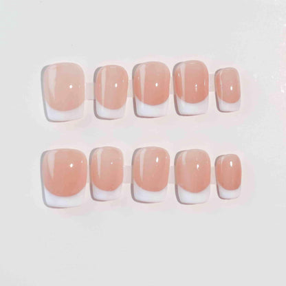 Square-shaped French nails with white tips and a nude base, delivering a clean and polished style perfect for various settings