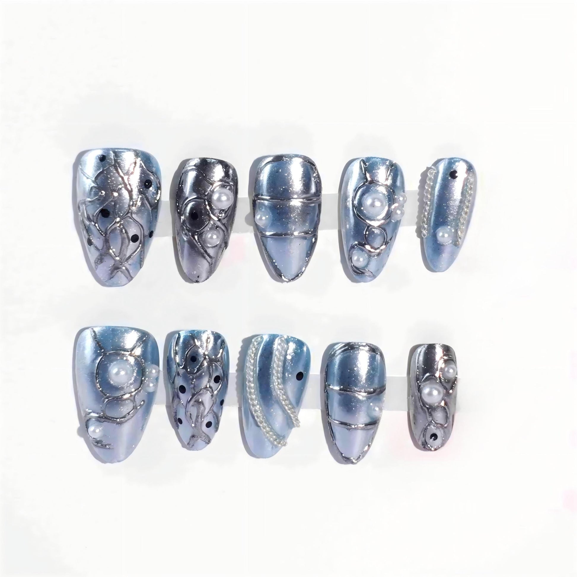 A stunning set of press-on nails in metallic blue, enhanced with silver wave patterns, delicate pearl accents, and glossy black details. This design exudes celestial grace and oceanic sophistication, perfect for an elegant and dreamy aesthetic.