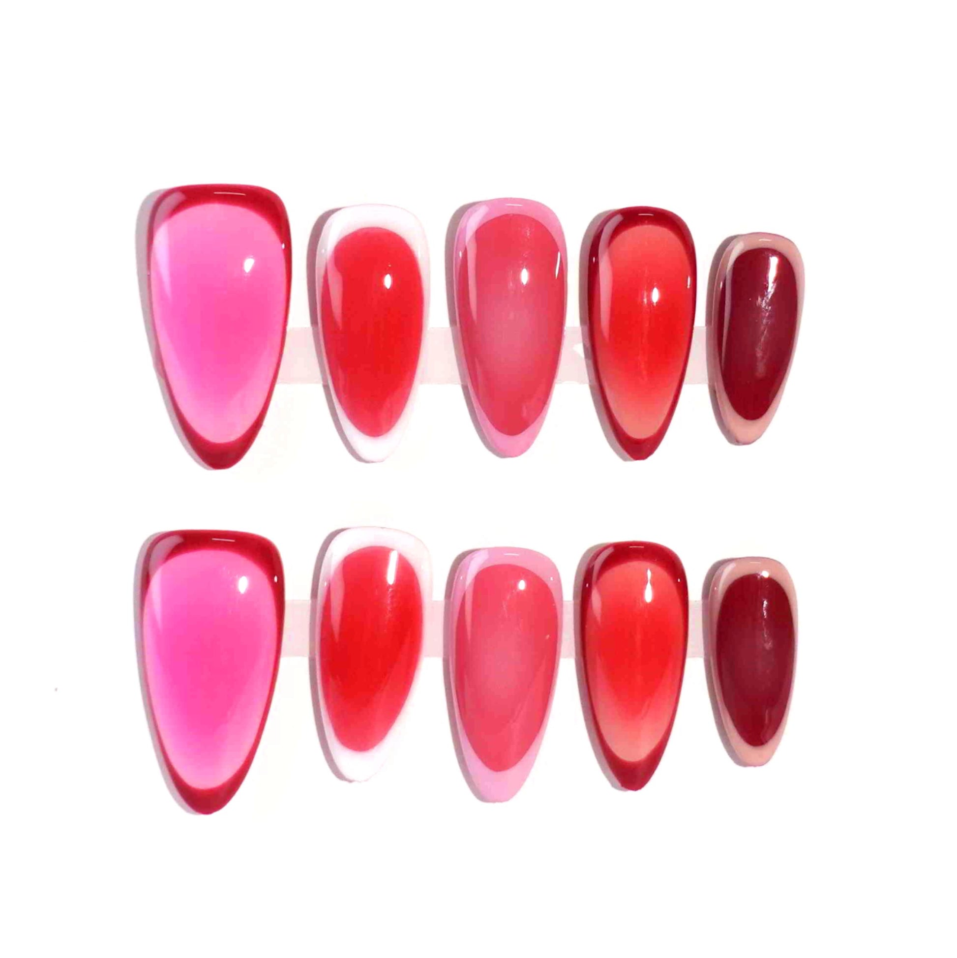 A set of press - on nails with a color gradient ranging from soft blush pink to rich berry red. The nails have a sophisticated and charming appearance, suitable for romantic evenings or formal gatherings.