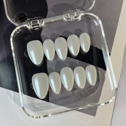 A luxurious press-on nail set with a smooth, pearly white finish, offering a refined and luminous design suitable for bridal looks and formal events.