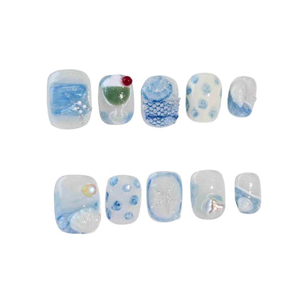 A captivating set of press-on nails in calming blue tones, featuring ocean-inspired designs such as seashells, delicate waves, and shimmering pearl details. Ideal for embracing a tranquil and sophisticated style.